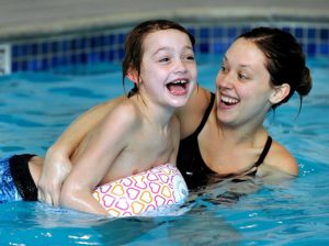 swimming, benefits of teaching swimming to special needs children, children swim,